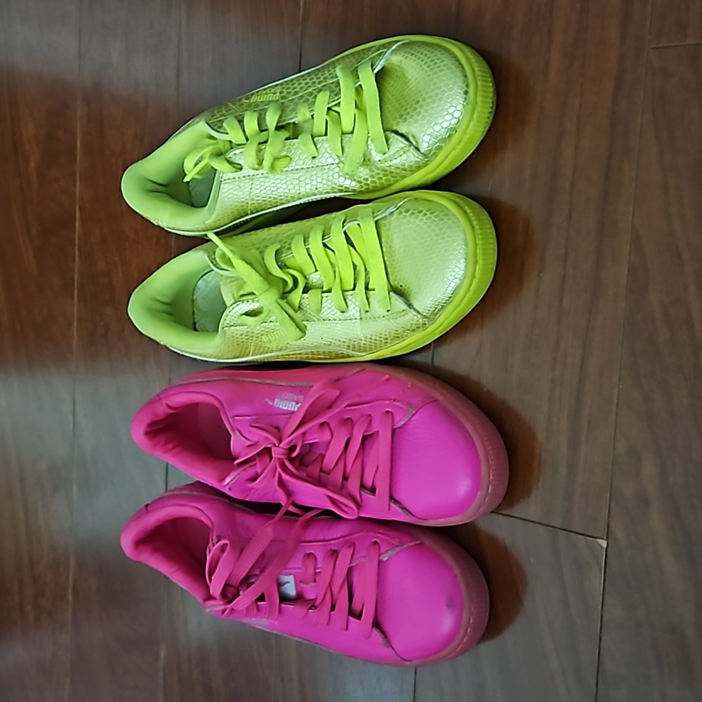2 pairs of neon colored Puma sneakers